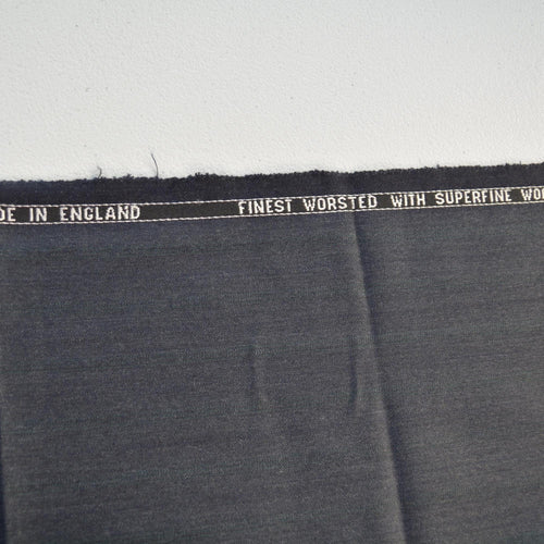 100% WOOL · Suiting