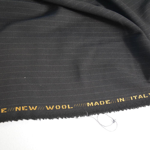 100% WOOL · Crepe