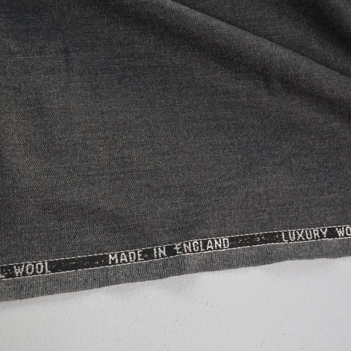 100% WOOL · Suiting