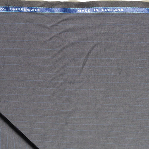 100% WOOL · Suiting