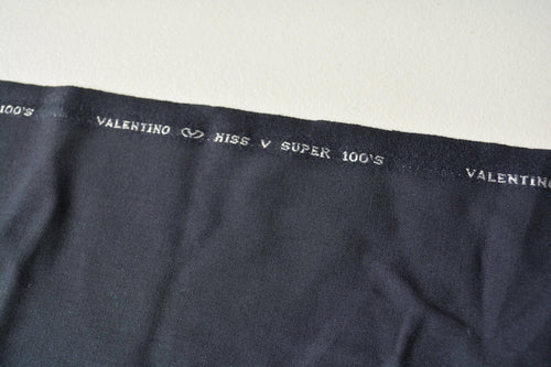 100% WOOL · Suiting